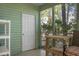 Bright screened porch with storage and access to backyard at 6240 April Pine Cir # B, North Charleston, SC 29406
