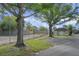Tennis court with chain-link fence and nearby storage building at 6240 April Pine Cir # B, North Charleston, SC 29406