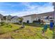 Large backyard with grassy area, garden, and detached garage at 645 Blueway Ave, Summerville, SC 29486