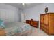 Bright bedroom with double bed and wooden dresser at 645 Blueway Ave, Summerville, SC 29486
