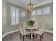 Charming dining room with a round table, four chairs, and a chandelier at 645 Blueway Ave, Summerville, SC 29486