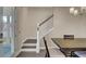 Elegant dining room features a wood table, staircase, and hardwood floors at 645 Blueway Ave, Summerville, SC 29486