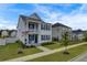 Two-story home with white siding, blue shutters, and a front porch at 645 Blueway Ave, Summerville, SC 29486