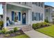 Inviting front porch with a porch swing and brick steps at 645 Blueway Ave, Summerville, SC 29486