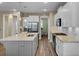 Modern kitchen with white cabinets, granite counters, and stainless steel appliances at 645 Blueway Ave, Summerville, SC 29486