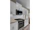Modern kitchen features white cabinets, granite countertops, and stainless steel appliances at 645 Blueway Ave, Summerville, SC 29486