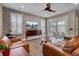 Spacious living room with hardwood floors, leather sofas, and sliding glass doors to patio at 645 Blueway Ave, Summerville, SC 29486