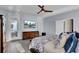 Main bedroom with king bed, TV, and private balcony at 645 Blueway Ave, Summerville, SC 29486