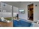 Covered porch with wicker furniture, TV, and view of backyard at 645 Blueway Ave, Summerville, SC 29486