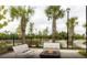 Relaxing firepit area with seating and palm trees at 741 Meadowbrook Ln, Summerville, SC 29486