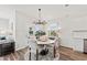 Bright dining area with round table, four chairs, and a chandelier at 741 Meadowbrook Ln, Summerville, SC 29486