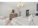 Main bedroom with large bed, dresser, and access to bathroom at 741 Meadowbrook Ln, Summerville, SC 29486