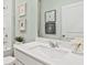 Clean bathroom with single vanity, mirror, and white cabinets at 752 Meadowbrook Ln, Summerville, SC 29486