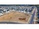 Expansive aerial shot of a neighborhood featuring contemporary homes surrounding serene ponds and green spaces at 1104 Cooper Point St, Summerville, SC 29485