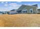 Large backyard with view of home's exterior at 1104 Cooper Point St, Summerville, SC 29485