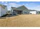 Large backyard with a view of the home's exterior at 1104 Cooper Point St, Summerville, SC 29485