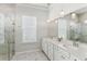 Elegant bathroom with double vanity, large shower, and marble floors at 1104 Cooper Point St, Summerville, SC 29485