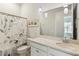 Clean bathroom with shower/tub combo and white vanity at 1104 Cooper Point St, Summerville, SC 29485