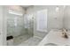 Spa-like bathroom with walk-in shower and marble tile at 1104 Cooper Point St, Summerville, SC 29485