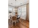 Dining room with round table and four chairs, hardwood floor at 1104 Cooper Point St, Summerville, SC 29485