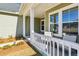 Front porch with white railing and seating area at 1104 Cooper Point St, Summerville, SC 29485