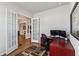 Home office with built-in desk and hardwood floors at 1104 Cooper Point St, Summerville, SC 29485