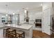 Modern kitchen with white cabinets, quartz countertops, and stainless steel appliances at 1104 Cooper Point St, Summerville, SC 29485