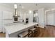 Modern kitchen with white cabinets, quartz countertops, and stainless steel appliances at 1104 Cooper Point St, Summerville, SC 29485