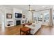 Spacious living room with fireplace, built-in shelving, and hardwood floors at 1104 Cooper Point St, Summerville, SC 29485