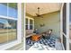 Screened porch with wicker furniture and ceiling fan at 1104 Cooper Point St, Summerville, SC 29485