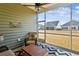 Relaxing screened porch with seating and a view of the backyard at 1104 Cooper Point St, Summerville, SC 29485