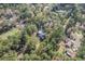 Aerial view showing home surrounded by trees and nearby houses at 112 New Hope Dr, Summerville, SC 29486