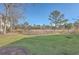 Large backyard with grassy area and trees at 1158 Village Creek Lane Unit 4 # 803, Mount Pleasant, SC 29464