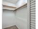 Simple closet with wooden shelves and hanging rods at 1158 Village Creek Lane Unit 4 # 803, Mount Pleasant, SC 29464