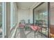 Bright sunroom with glass doors and two chairs at 1158 Village Creek Lane Unit 4 # 803, Mount Pleasant, SC 29464