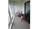 Relaxing sunroom with seating area and large windows at 1158 Village Creek Lane Unit 4 # 803, Mount Pleasant, SC 29464