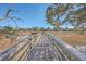 Long wooden dock extending over calm water, offering scenic views at 1158 Village Creek Lane Unit 4 # 803, Mount Pleasant, SC 29464