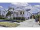 White cottage with front porch, brick accents, and driveway at 127 Simons St, Charleston, SC 29403