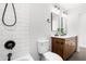 Modern bathroom with double vanity and white tile at 1994 Groveland Ave, North Charleston, SC 29405