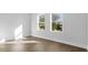 Bright bedroom with hardwood floors and large windows at 1994 Groveland Ave, North Charleston, SC 29405