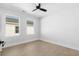 Spacious bedroom with wood floors and dual windows at 1994 Groveland Ave, North Charleston, SC 29405