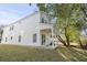White house with covered patio and side yard at 1994 Groveland Ave, North Charleston, SC 29405