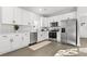 Modern kitchen with white cabinets, stainless steel appliances, and quartz countertops at 1994 Groveland Ave, North Charleston, SC 29405