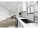 Modern kitchen with white cabinets, stainless steel appliances, and quartz countertops at 1994 Groveland Ave, North Charleston, SC 29405