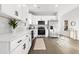 Modern kitchen with white cabinets, stainless steel appliances, and quartz countertops at 1994 Groveland Ave, North Charleston, SC 29405