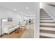 Open concept living room with kitchen and staircase view at 1994 Groveland Ave, North Charleston, SC 29405