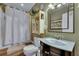 Clean bathroom with shower/tub combo, vanity, and linen storage at 2007 Central Ave, Summerville, SC 29483