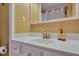 Clean bathroom with white vanity and gold fixtures at 2007 Central Ave, Summerville, SC 29483