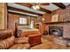Cozy bedroom with brick fireplace, wood ceiling beams, and built-ins at 2007 Central Ave, Summerville, SC 29483