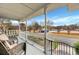Spacious front porch with seating and a view of the street at 2007 Central Ave, Summerville, SC 29483